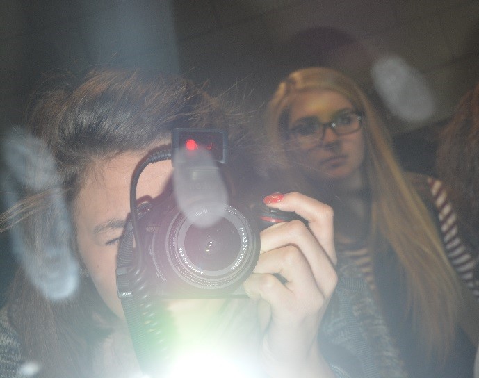 CMU student photographs fingerprints on a mirror. 